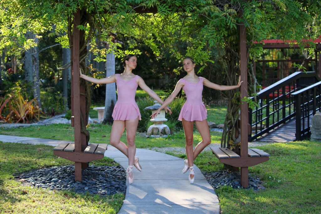 An image of two ballet dancers in a park. Academy of Ballet Arts in St. Petersburg, FL.